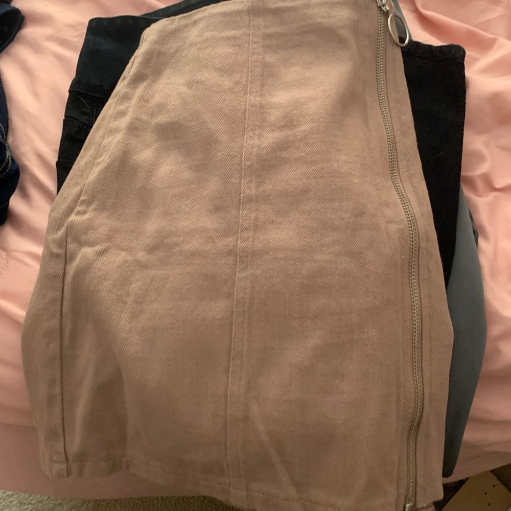 Pink zip up skirt.